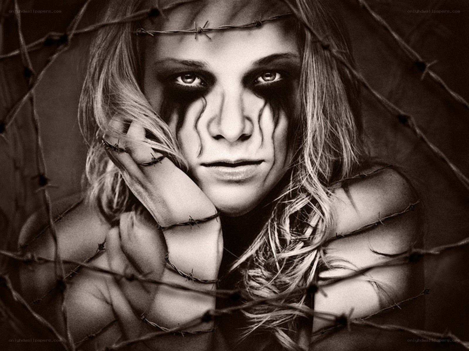 woman behind barbed wire