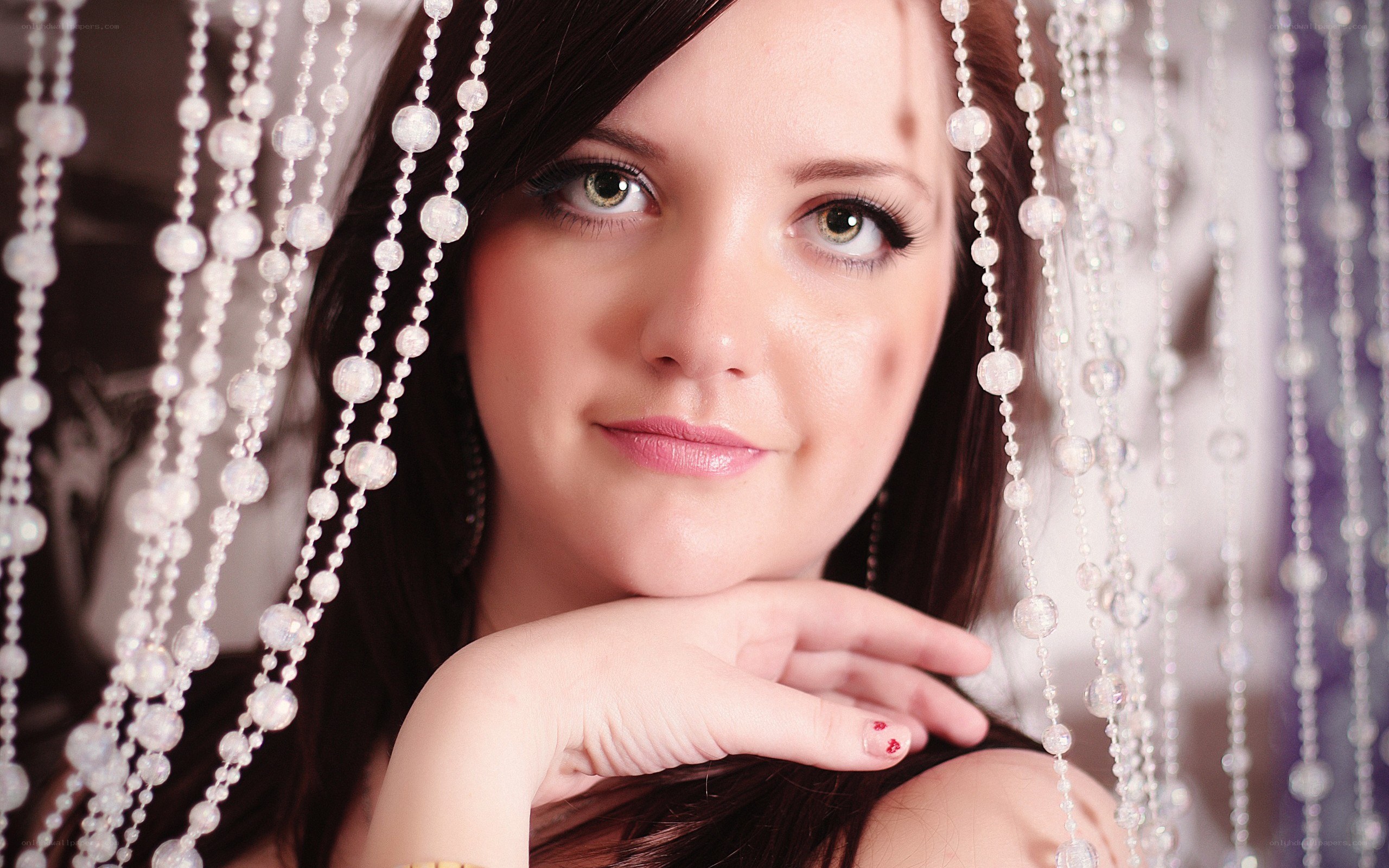 woman behind beaded curtain