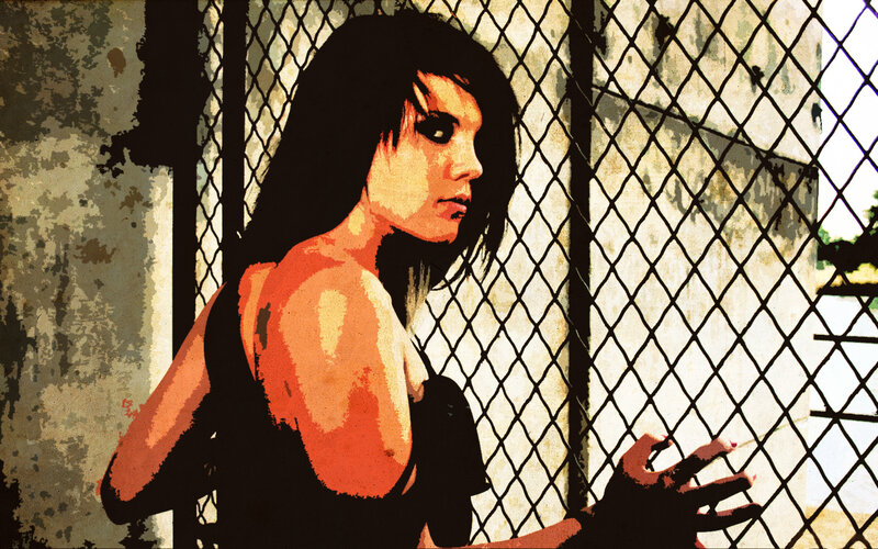 woman behind chain-link fence