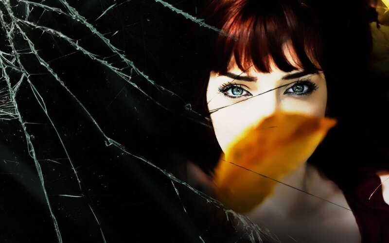 woman behind cracked glass