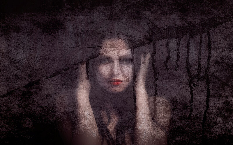 Woman Behind Cracked Surface