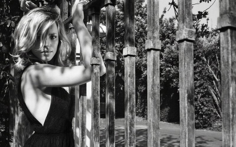 Woman Behind Fence — Black, Dramatic