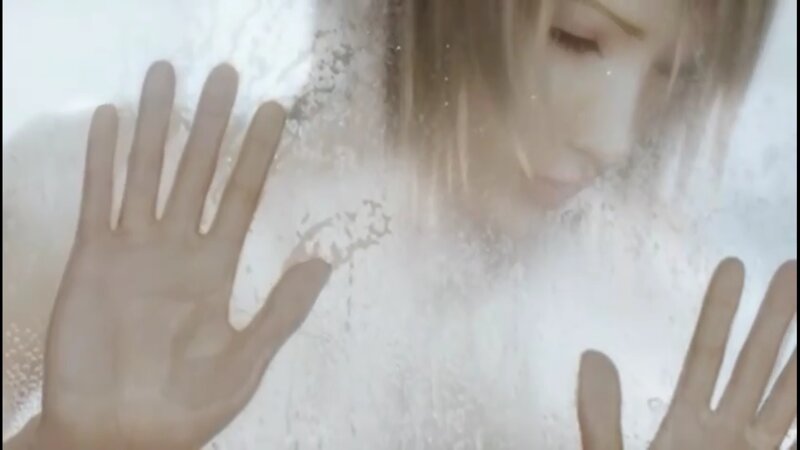 woman behind frosted glass