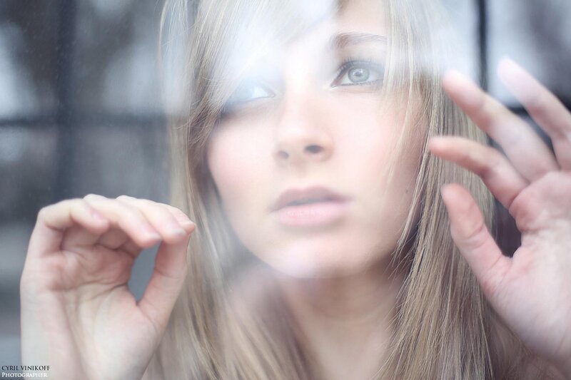 woman behind glass window