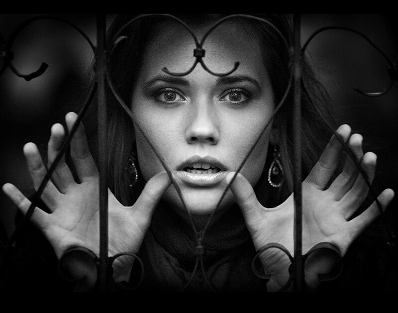 Woman Behind Iron Bars