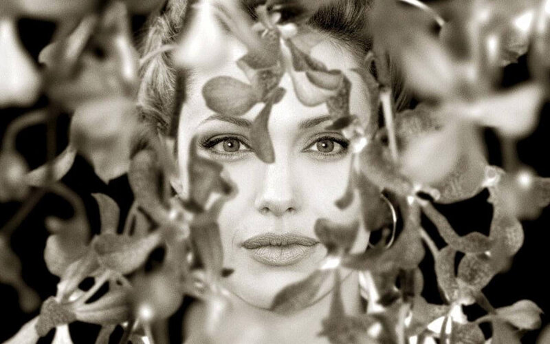 woman behind leaves