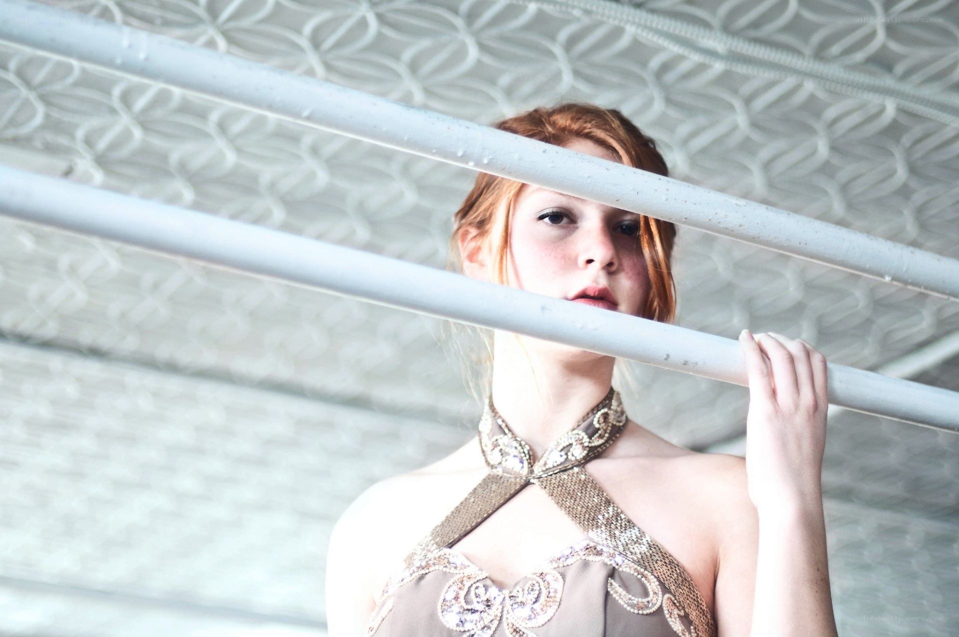 woman behind metal bars