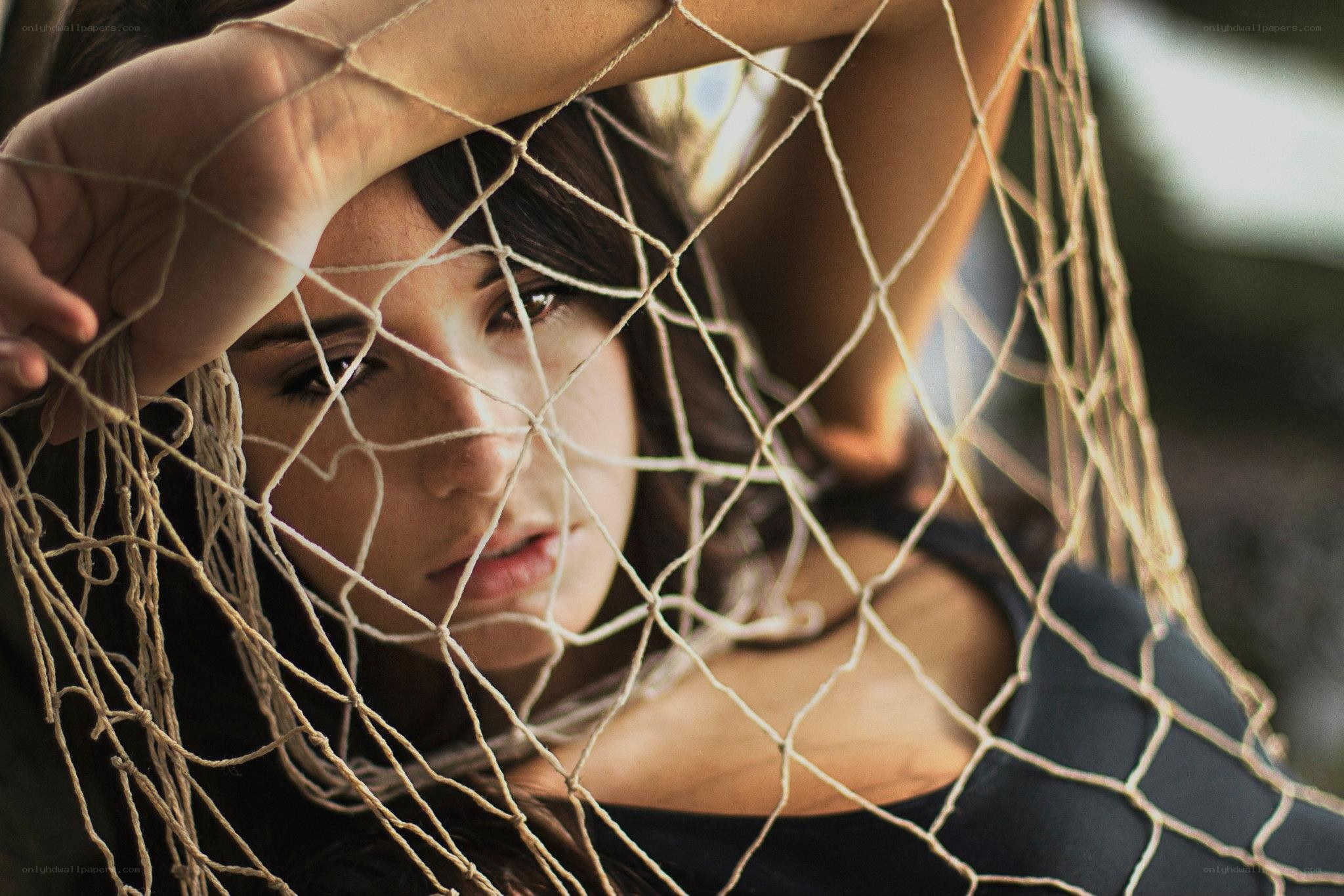 woman behind netting