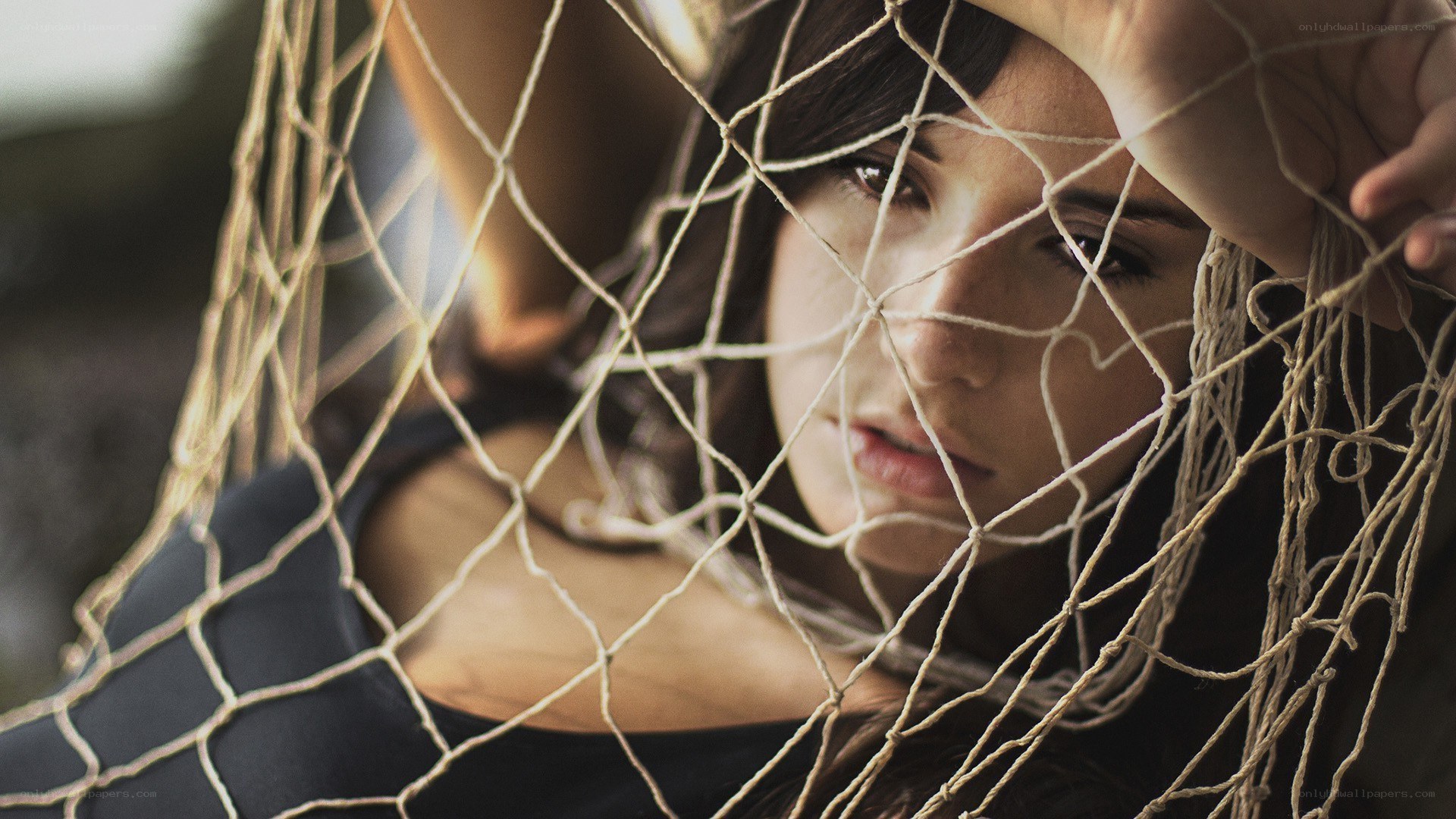 woman behind netting