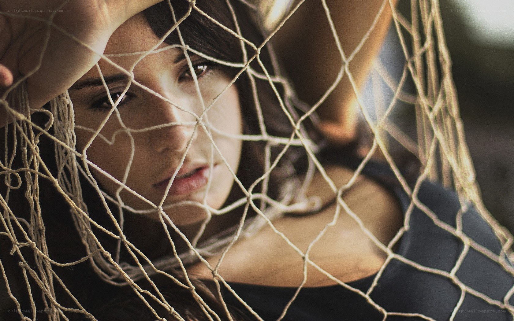 woman behind netting