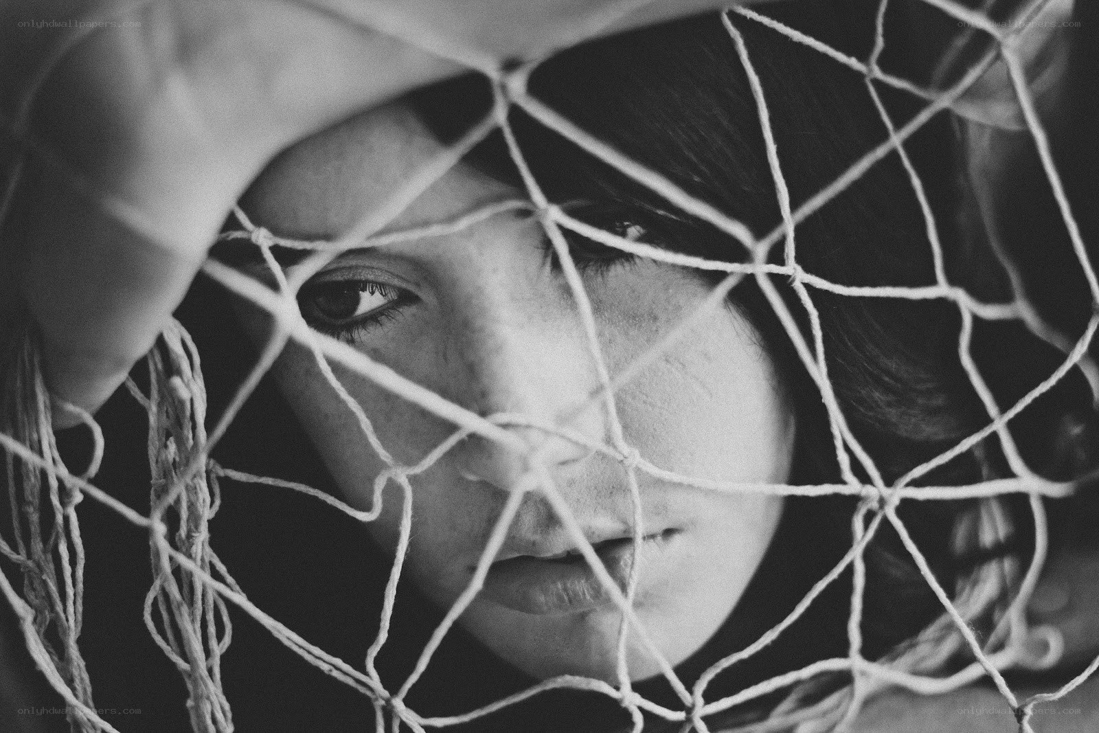 woman behind netting