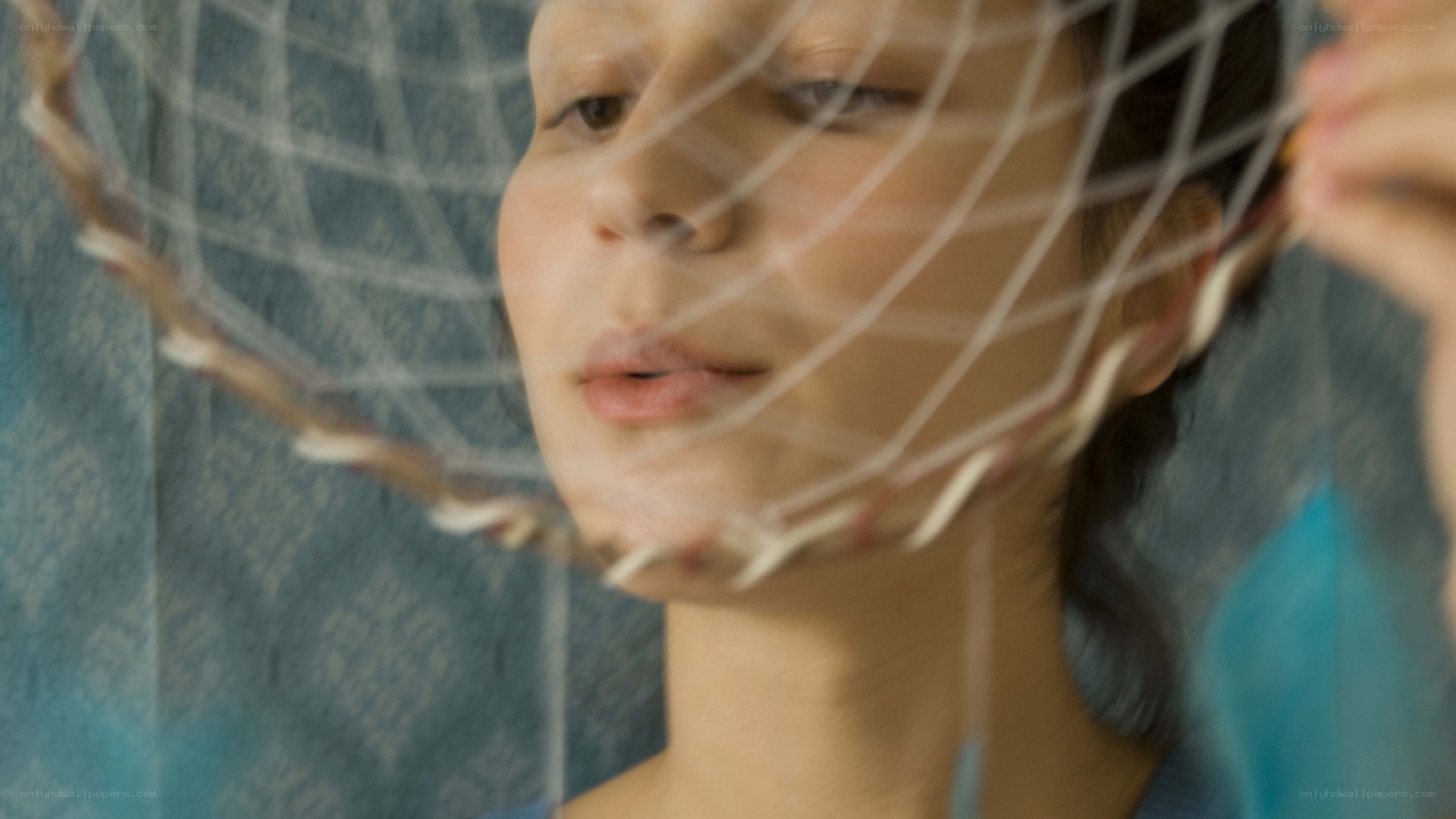 woman behind netting