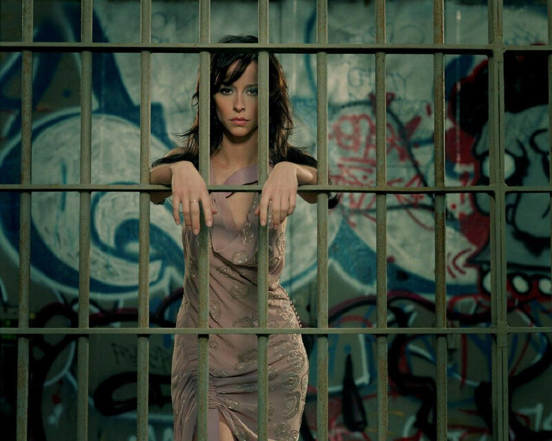 woman behind prison bars