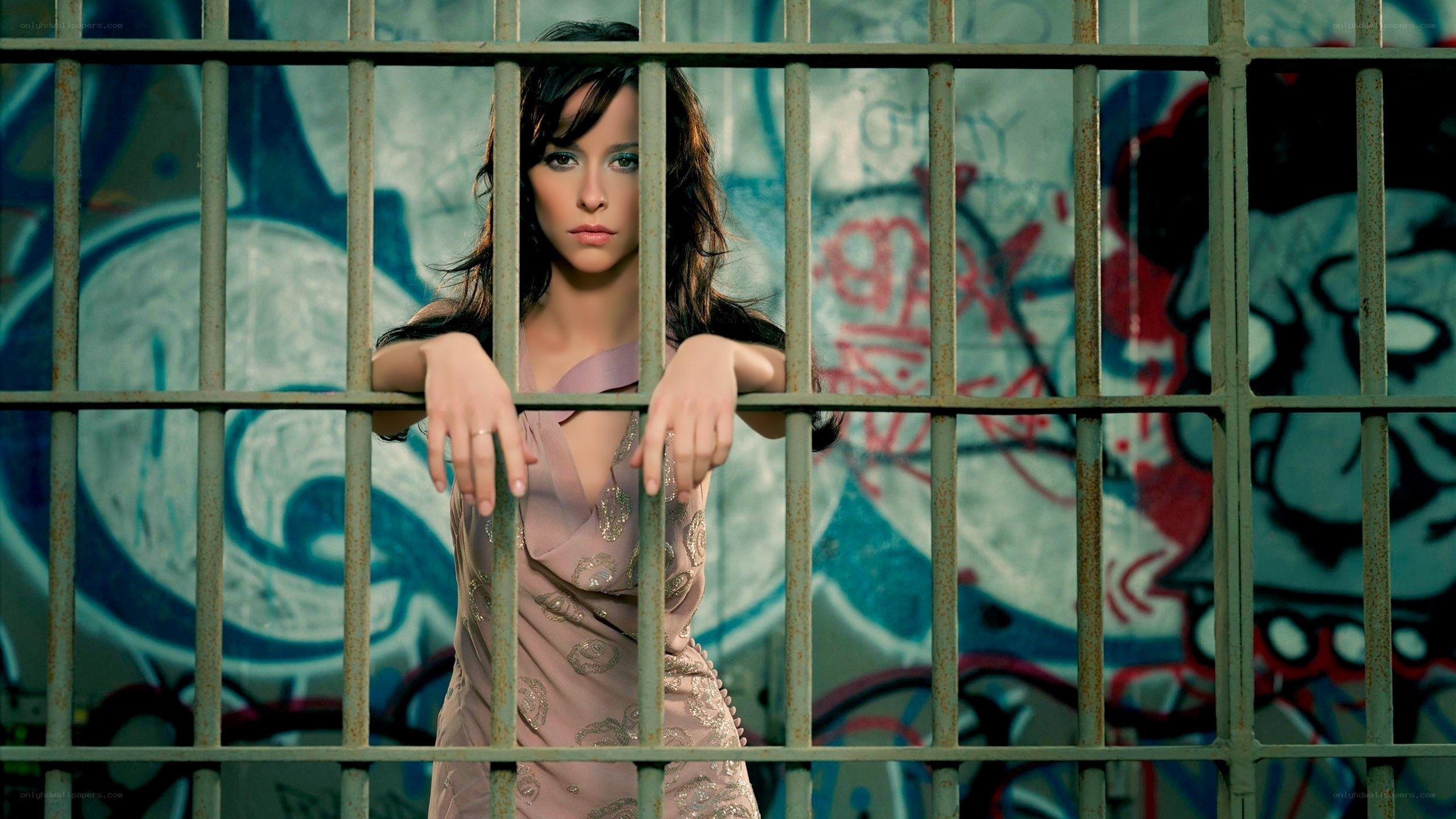woman behind prison bars