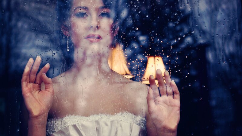 Woman Behind Rain-covered Glass — Blue, Dramatic