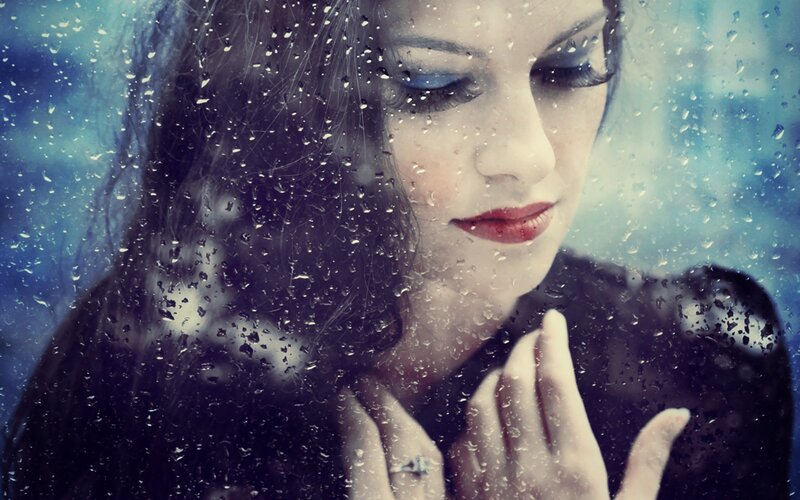 Woman Behind Rain-streaked Glass — Blue