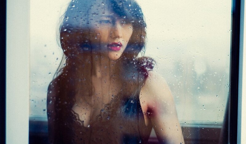 Woman Behind Rain-streaked Window — Brown