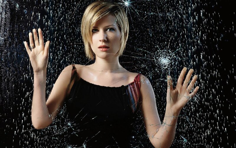 woman behind shattered glass