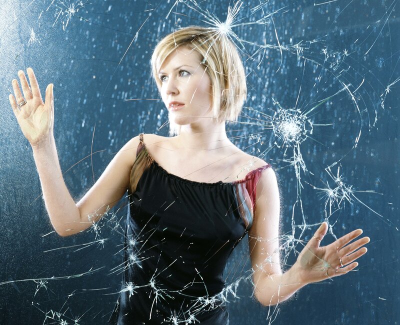 woman behind shattered glass