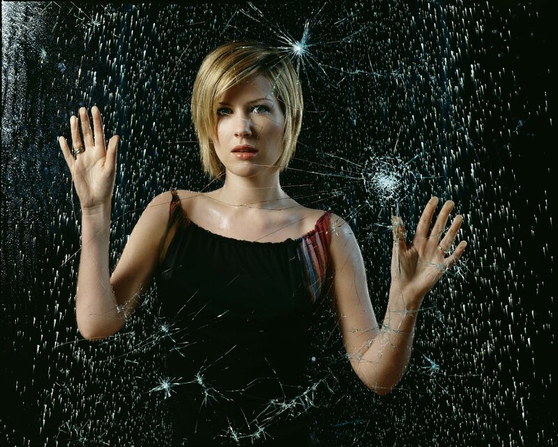 woman behind shattered glass