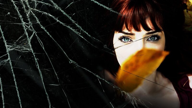 woman behind shattered glass