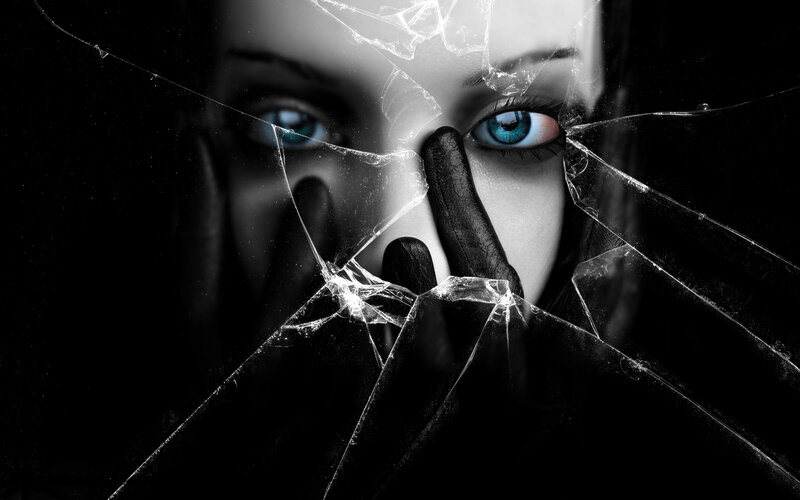 woman behind shattered glass