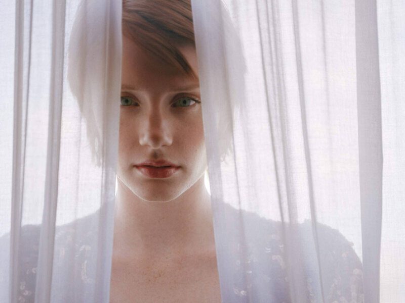 woman behind sheer curtain