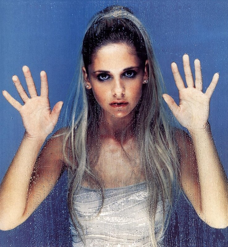woman behind wet glass