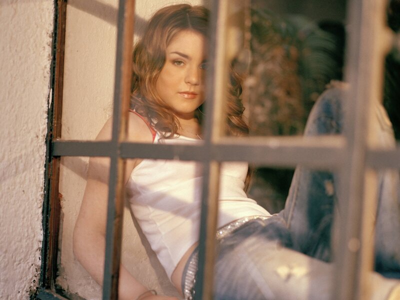 woman behind window bars