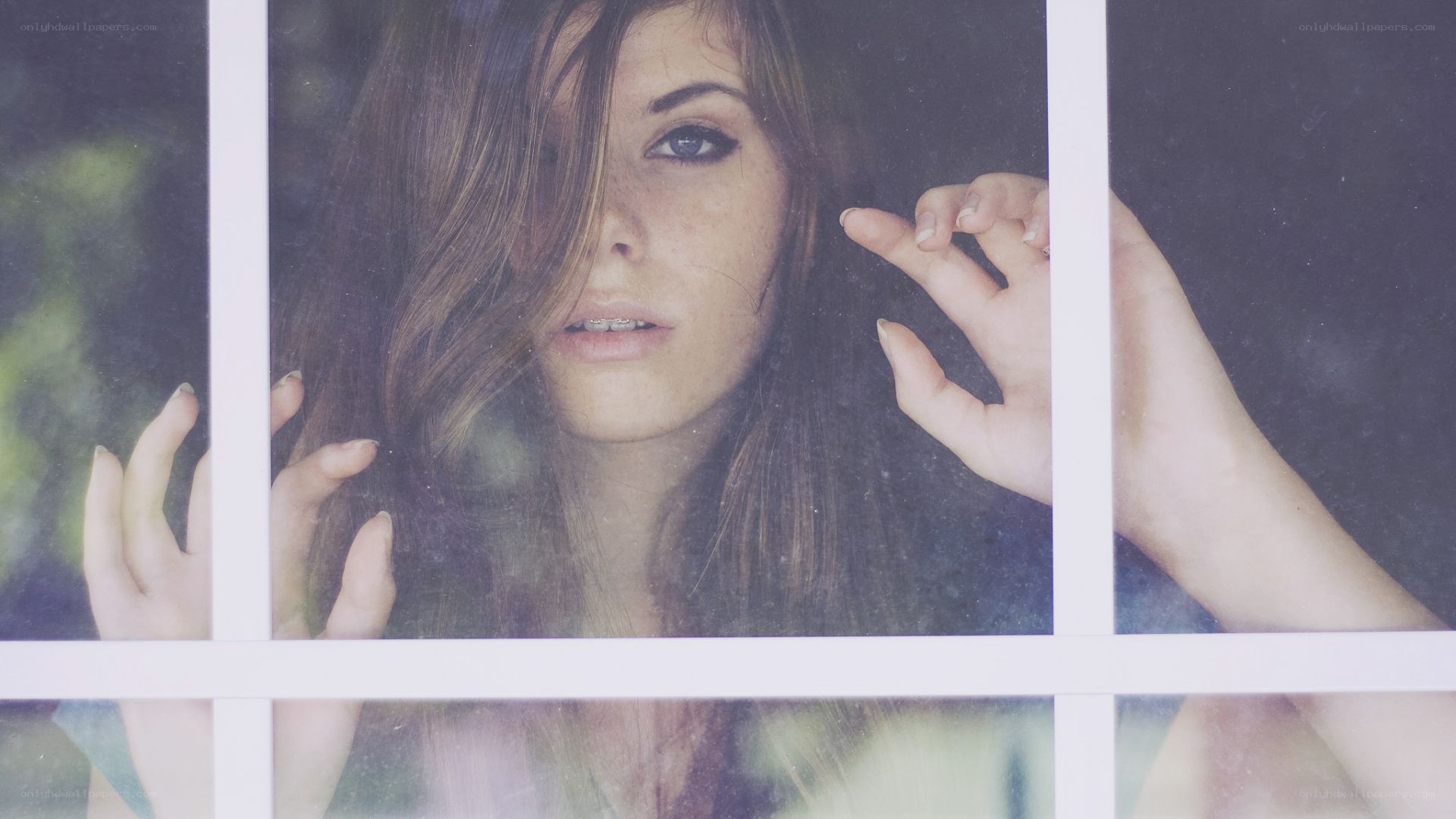 woman behind window glass