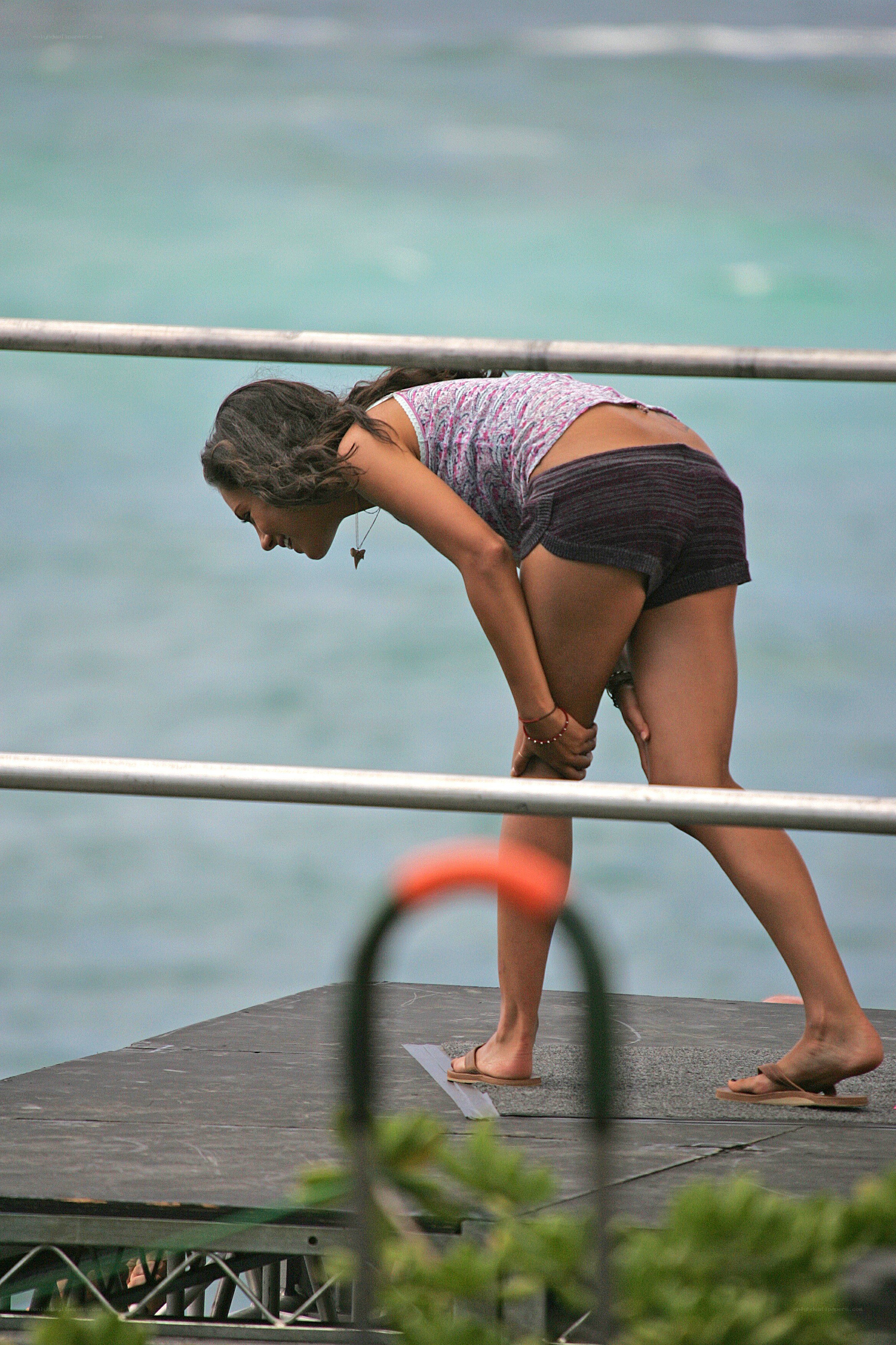 woman bending on dock