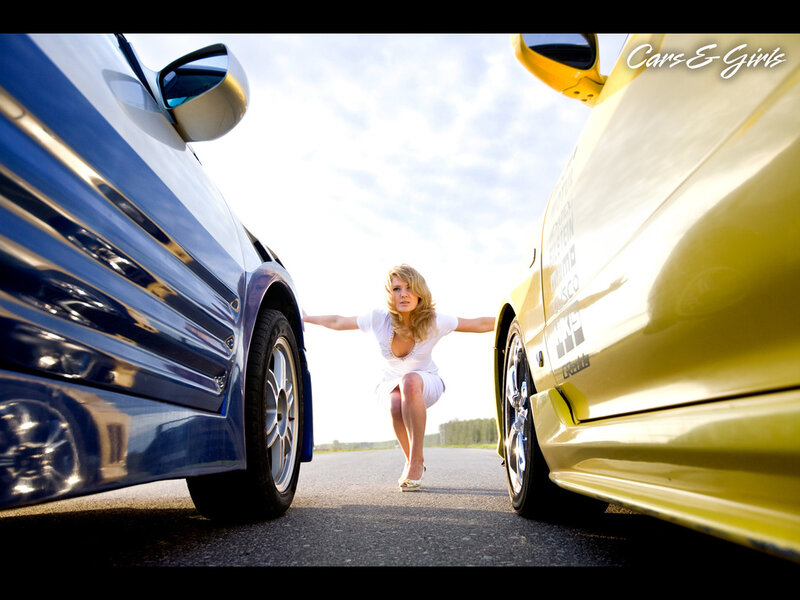 Woman Between Two Cars — Blue, Dramatic, Afternoon