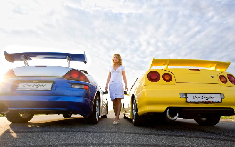 Woman Between Two Cars — Yellow, Dramatic, Sunset