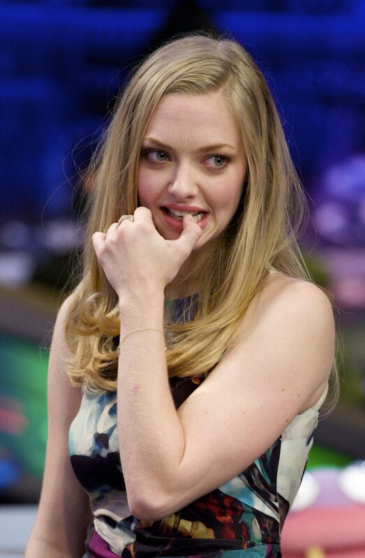 woman biting finger