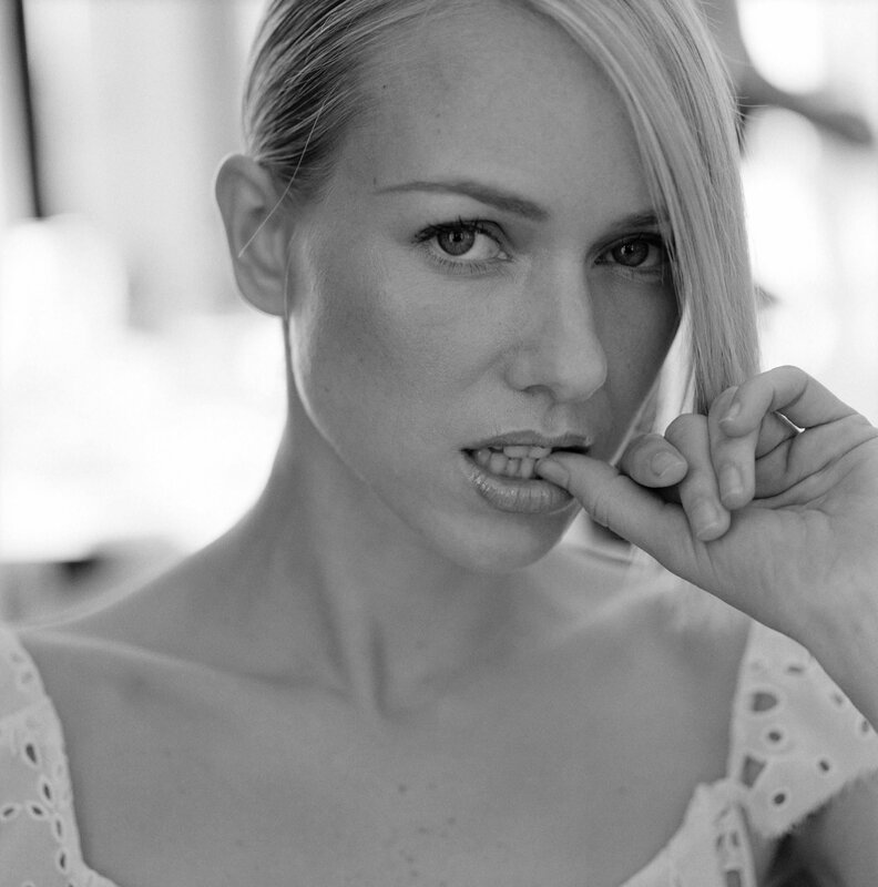 woman biting finger in black and white