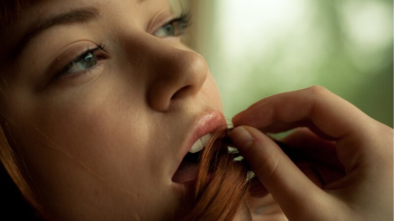 woman biting hair