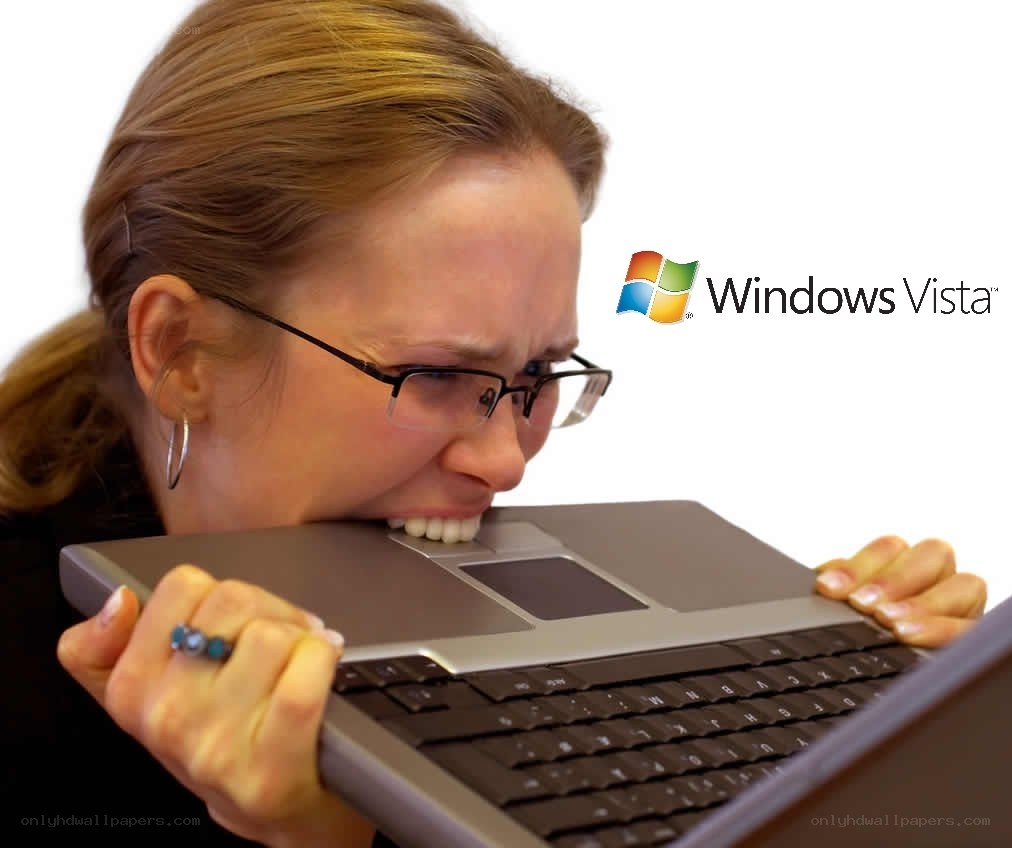 woman biting laptop