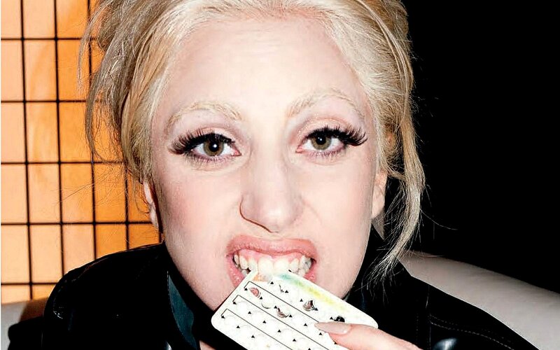 Woman Biting Pill Pack