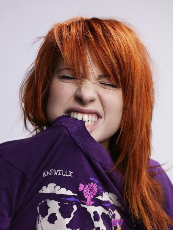 woman biting t-shirt