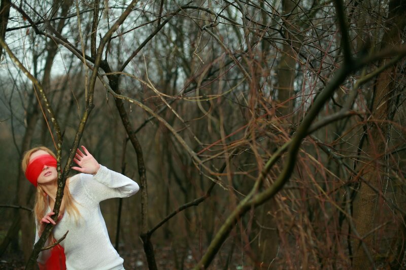 Woman Blindfolded in Woods