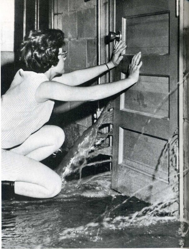 woman blocking floodwater