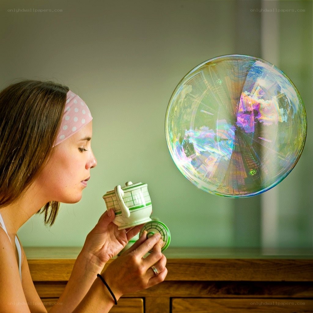woman blowing a bubble