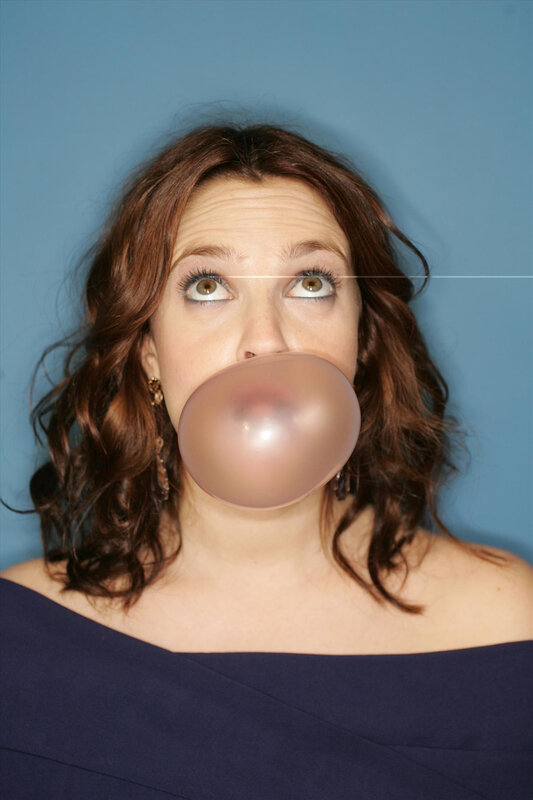 woman blowing bubble gum