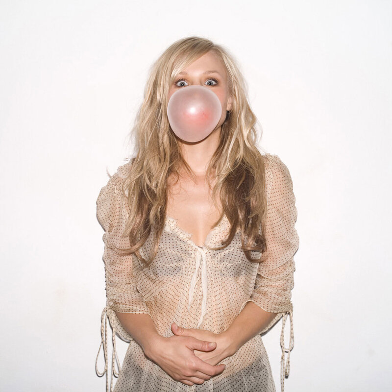 woman blowing bubble gum
