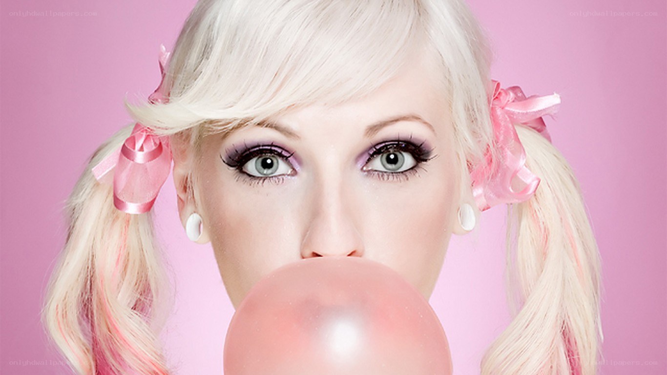 woman blowing bubble gum