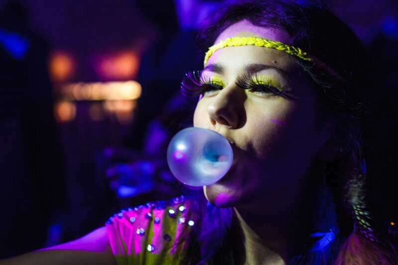 woman blowing bubble gum