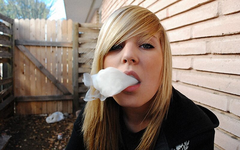 woman blowing bubble gum