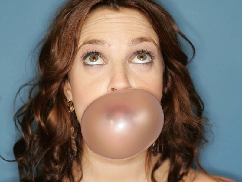woman blowing bubble gum