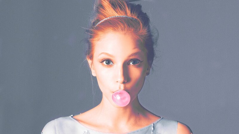 woman blowing bubble gum