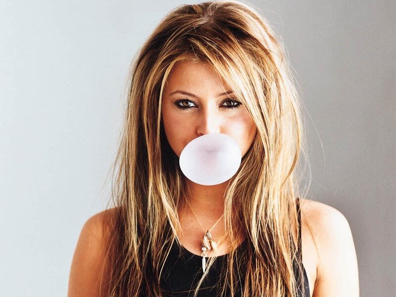 woman blowing bubble gum